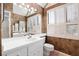 Bathroom featuring a large mirror, recessed lighting, and stylish shuttered windows at 1621 Ne 2Nd St # 601, Ocala, FL 34470