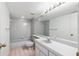 Cozy bathroom featuring tile flooring and a large mirror above the sink at 1621 Ne 2Nd St # 601, Ocala, FL 34470