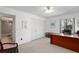 Bright bedroom featuring neutral carpet, a closet, and a large window offering natural light at 1621 Ne 2Nd St # 601, Ocala, FL 34470
