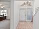 Bright entryway with tile flooring, double door and views into the office, creating an inviting and functional space at 1621 Ne 2Nd St # 601, Ocala, FL 34470