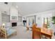 Cozy living room with a fireplace, built-in bookshelves, and access to the patio at 1621 Ne 2Nd St # 601, Ocala, FL 34470