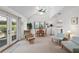 Bright open-concept living room with high ceilings, complemented by neutral decor and large windows, creating an airy space at 1621 Ne 2Nd St # 601, Ocala, FL 34470