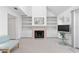 Cozy living room featuring a fireplace with built-in shelving, providing a warm and inviting atmosphere at 1621 Ne 2Nd St # 601, Ocala, FL 34470