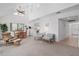 Bright living room with vaulted ceilings, a ceiling fan, tile floors and comfortable seating with eat in kitchen at 1621 Ne 2Nd St # 601, Ocala, FL 34470