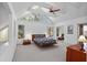 Spacious bedroom with vaulted ceiling, large windows, and a cozy ambiance at 1621 Ne 2Nd St # 601, Ocala, FL 34470