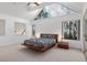 Serene bedroom boasts a high, angled ceiling and multiple windows providing ample natural light at 1621 Ne 2Nd St # 601, Ocala, FL 34470