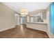 Spacious living room featuring hardwood floors and entry to kitchen at 1903 Nw 50Th Cir, Ocala, FL 34482