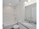 Bathroom featuring a tub and shower combo, granite sink, and modern fixtures at 22 Juniper Drive Crse, Ocala, FL 34480