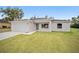 Newly built single Gathering home with an attached garage and a well-manicured front lawn at 22 Juniper Drive Crse, Ocala, FL 34480