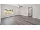 Living room featuring neutral paint, vinyl plank flooring and a big window at 22 Juniper Drive Crse, Ocala, FL 34480