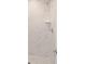 Shower features white marble-look tile, a built-in shelf, and modern fixtures at 22 Juniper Drive Crse, Ocala, FL 34480