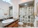 Bathroom featuring a vanity with a sink and a shower with a curtain at 383 Harlow Ln, The Villages, FL 32163
