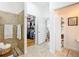 Bathroom view featuring the tile shower, closet and shelving at 383 Harlow Ln, The Villages, FL 32163