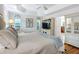 Light and airy bedroom featuring modern decor and shutters at 383 Harlow Ln, The Villages, FL 32163