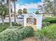 The Villages of LaBelle Pool community sign with lush landscaping at 383 Harlow Ln, The Villages, FL 32163