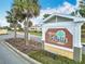 Street view of the Villages of LaBelle North sign amid lush landscaping at 383 Harlow Ln, The Villages, FL 32163