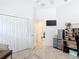 Bright home office with desk, closet, and view to the front entry at 383 Harlow Ln, The Villages, FL 32163