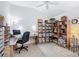 Bright office featuring a workspace, built-in shelving and ample storage at 383 Harlow Ln, The Villages, FL 32163