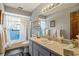 Neutral bathroom with a bathtub and shower, vanity, and soft lighting at 4420 Ne 1St St, Ocala, FL 34470