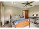 Well-lit bedroom with a bed, wood floors, and a closet at 4420 Ne 1St St, Ocala, FL 34470