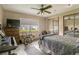 Bright bedroom with a bed, large window, and wood floors at 4420 Ne 1St St, Ocala, FL 34470
