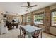 Inviting dining area with brick accents, views of the pool, and plenty of natural light at 4420 Ne 1St St, Ocala, FL 34470