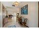 Inviting foyer with tile floors and natural light highlighting the artwork and open floorplan at 4420 Ne 1St St, Ocala, FL 34470