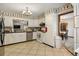 Well-maintained kitchen with white cabinetry, neutral countertops, and convenient stainless steel appliances at 4420 Ne 1St St, Ocala, FL 34470