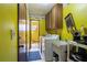 Functional laundry area with ample cabinet space and a utility sink for convenience at 4420 Ne 1St St, Ocala, FL 34470