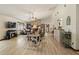 Open-concept living room with a fireplace and cozy seating at 4420 Ne 1St St, Ocala, FL 34470