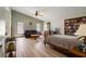 Spacious main bedroom boasts vaulted ceiling, laminate floors, and a cozy sitting area at 4420 Ne 1St St, Ocala, FL 34470