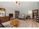 This carpet-free main bedroom features a large bed, dresser, and a view of the entry at 4420 Ne 1St St, Ocala, FL 34470