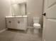 Bathroom with double sink vanity, neutral paint, and updated fixtures at 4501 Sw 110Th Ln, Ocala, FL 34476