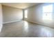 A bedroom with neutral colored walls and two windows at 4501 Sw 110Th Ln, Ocala, FL 34476