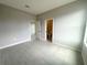 A bedroom with tile flooring, a walk-in closet and a bathroom with great natural light at 4501 Sw 110Th Ln, Ocala, FL 34476