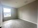 Bedroom showcasing tile floors and a large window for natural light at 4501 Sw 110Th Ln, Ocala, FL 34476