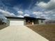Charming single-story home with a two-car garage and modern architectural accents at 4501 Sw 110Th Ln, Ocala, FL 34476