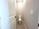 Powder room features a standard toilet and neutral paint at 4501 Sw 110Th Ln, Ocala, FL 34476