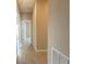 Hallway with stylish wood-style tile flooring and neutral paint at 4501 Sw 110Th Ln, Ocala, FL 34476