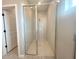 Modern walk-in shower features glass doors and neutral tile at 4501 Sw 110Th Ln, Ocala, FL 34476