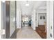 Bright foyer with neutral tile flooring, leading into a spacious living area with hardwood floors at 4651 Sw 65Th Pl, Ocala, FL 34474