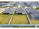 Aerial view of the property highlighting the spacious backyard, screened pool, and landscaping at 503 Verlander St, The Villages, FL 34762