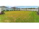 Expansive backyard featuring lush green grass and manicured landscaping, perfect for outdoor activities and relaxation at 503 Verlander St, The Villages, FL 34762