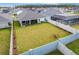 Aerial view of the expansive backyard, screened-in pool, and outdoor living space at 503 Verlander St, The Villages, FL 34762