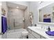 Stylish bathroom featuring a tiled shower, a unique sculpture, and modern fixtures at 503 Verlander St, The Villages, FL 34762