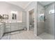 The bathroom offers a modern design with a walk-in shower, spacious vanity, and stylish fixtures at 503 Verlander St, The Villages, FL 34762