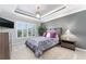Cozy bedroom with a gray color scheme, plantation shutters, and a stylish ceiling fan at 503 Verlander St, The Villages, FL 34762