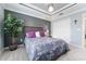Spacious bedroom with carpet, a large window, ceiling detail and a closet at 503 Verlander St, The Villages, FL 34762