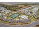 Aerial view of community amenities, including a pool, tennis courts, and recreational areas at 503 Verlander St, The Villages, FL 34762