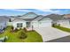 Beautiful home with a well-kept front yard and a spacious driveway, showcasing curb appeal at 503 Verlander St, The Villages, FL 34762